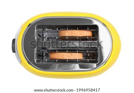Electric toaster with bread slices isolated on white, top view