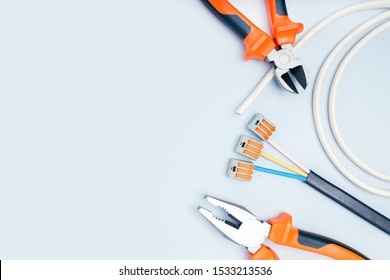 Electric Tools And Equipment On Grey Background With Copy Space.