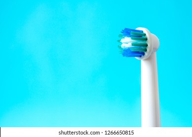 Electric Toothbrush Closeup On Blue Background Stock Photo 1266650815