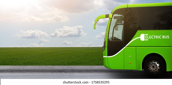 Electric Tourist Bus On A Background Of Green Field