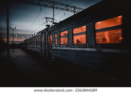 An electric train at evening in winter