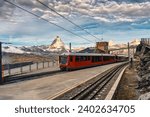 The electric train with Matterhorn mountain on summit at Gornergrat railway station in Zermatt, Switzerland