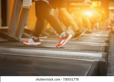 Electric Treadmills,People Running In Machine Treadmill At Fitness Gym,asian Man Exercising ,health Care Sport Concept,selective Focus,vintage Color,in The Morning