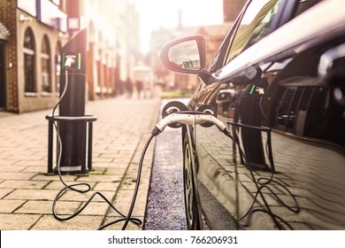 Electric Vehicle Is Changing In Street.
