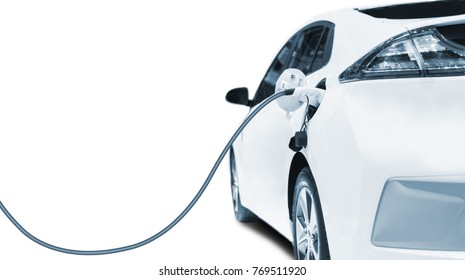 Electric vehicle charging, Charging an electric car in residential garage, Future of transportation - Shutterstock ID 769511920