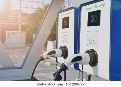 electric vehicle charging (Ev) station with plug of power cable supply for Ev car. Nfc payment. Smart enegy. Flare light effect.