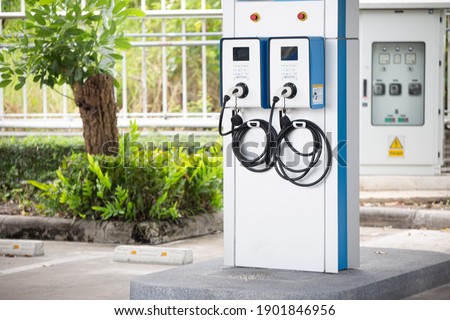 electric vehicle charging (Ev) station with plug of power cable supply for Ev car. Nfc payment. Smart enegy.