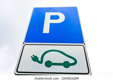 Electric vehicle charging sign. Parking reserved for electric cars. Charging station. 