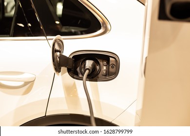 Electric vehicle charging station for home with EV car background - Shutterstock ID 1628799799