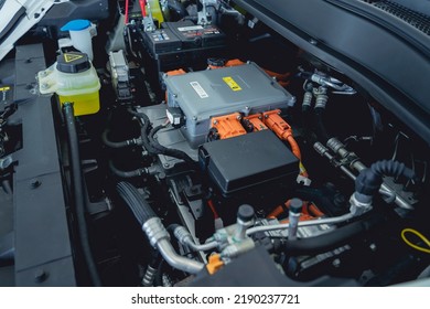 Electric vehicle with open hood and details of electric car engine - Shutterstock ID 2190237721