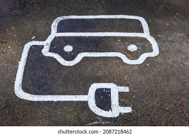 Electric Vehicle Recharging Point Road Marking Sign In England UK