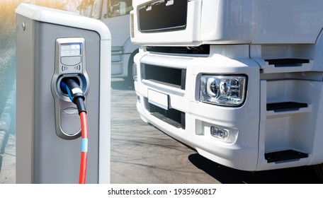 Electric vehicles charging station on a background of a truck. Concept