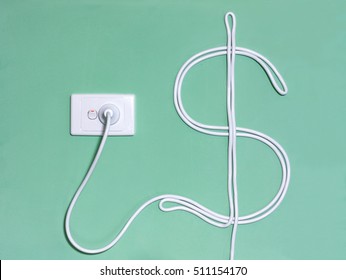 Electric Wall Outlet And Power Cord In The Dollar Sign To Illustrate The Concept Of Electricity And Utility Cost, Expense And Bills.