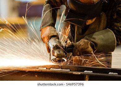 Electric wheel grinding on steel structure in factory - Powered by Shutterstock