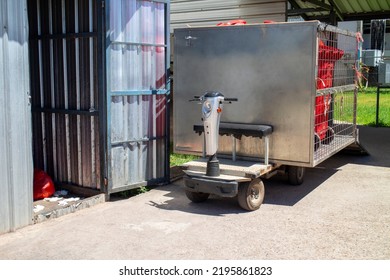 Electric Wheelchairs Are Used To Transport Hazardous Waste Bins In Hospitals.