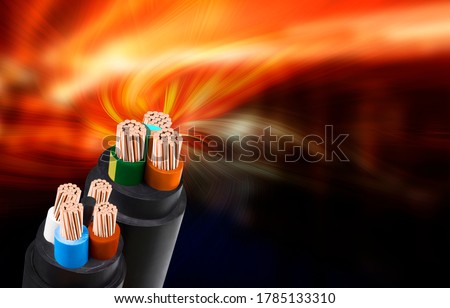 Electric wire on fire background. Copper wire is the electrical conductor of the city society.