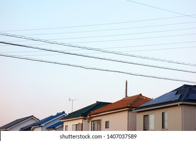 Electric Wire And Telephone Pole In Residential Area                                