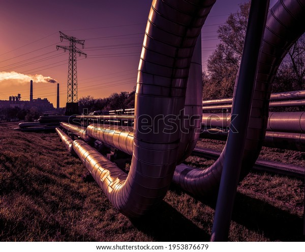 Electric\
wires and district heating tubes at\
sunrise