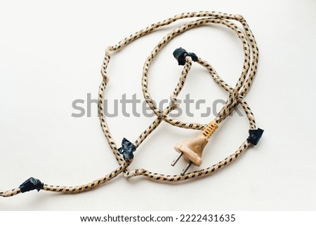Electric wires. Old electrical wires on a white background. Electric cord wrapped with electrical tape
