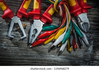 Electric wires pliers insulation wire cutter nippers on wooden board. - Shutterstock ID 1196968279