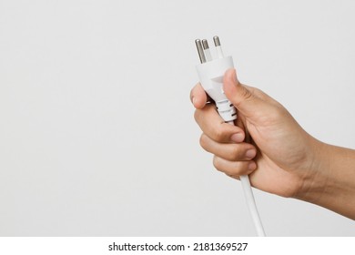 Electrical appliances plugs full of all plugs or plugs together. Because of the risk of causing a short circuit from high heat accumulated in the wires. - Shutterstock ID 2181369527