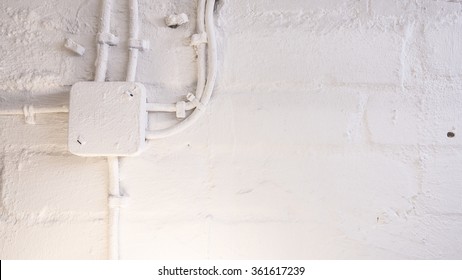 Electrical Box And Cables On Wall, Painted White