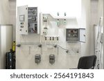 Electrical cabinets with wires. Power shields on wall room. Electrical equipment at enterprise. Power cabinets with open doors. Electrical engineering communications. Equipment for electrification