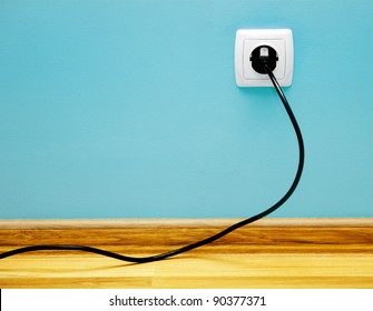 Electrical Cable Into The Socket. Home Shot.