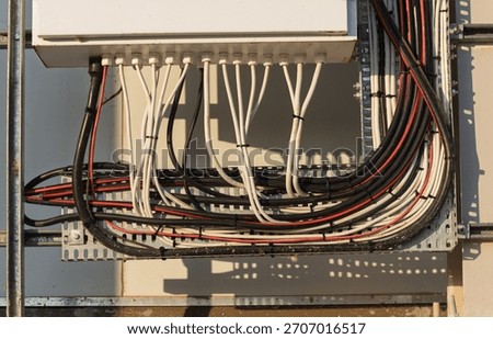 electrical cable management system, within an outdoor telecommunications or industrial cabinet. Industrial electric outdoors cabinet with wires , metal shield box with column