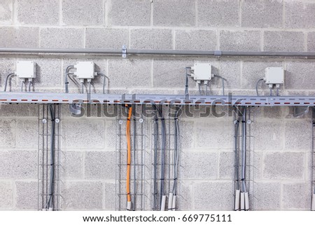 Electrical cables are located in a cableway in a building