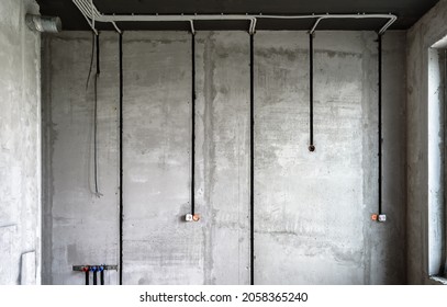 Electrical Cables And Pipes On House Concrete Wall. Modern Plastic Hoses And Conduits With Wires In Room. Lines Of Pvc Wiring Tubes After Professional Work. Renovation Of Home Or Factory Interior.