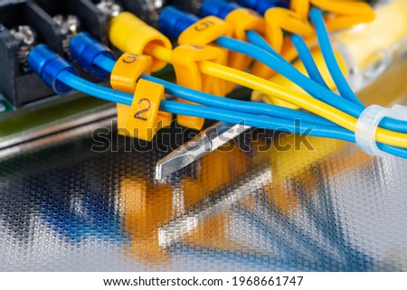 Electrical cabling and hand tool on metal sufrace service and re