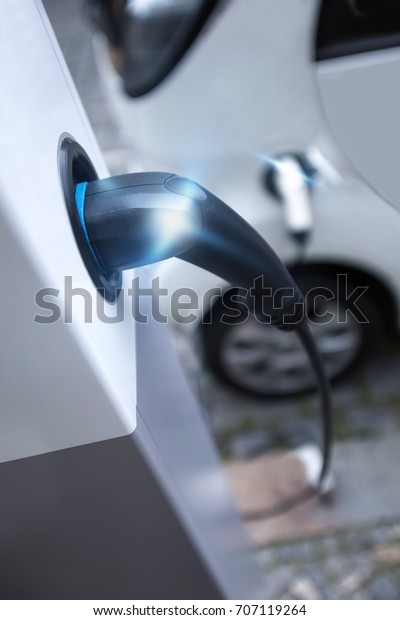 electrical car charging\
on a charging pillar