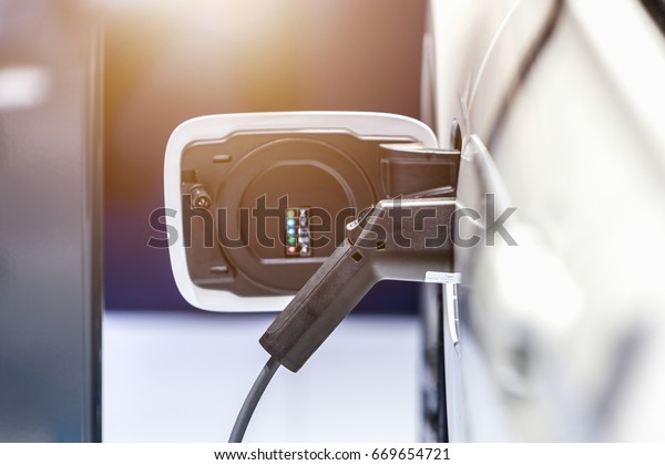 Electrical car charging from public battery\
charging system, selective\
focus