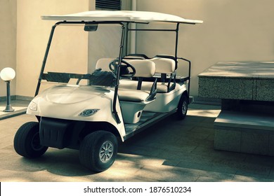 Electrical Car Of Hotel Or Resort Service. Closeup View. Golf Car Close Up. Long Electric Shuttle Passenger Bus.