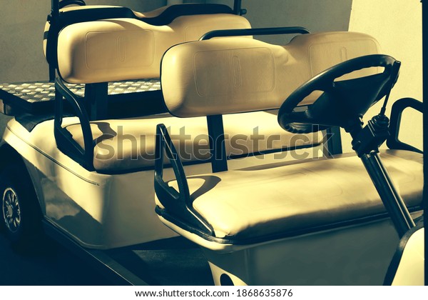 Electrical Car Of
Hotel Or Resort Service. Closeup View. Golf Car Close Up. Long
Electric Shuttle Passenger
Bus.