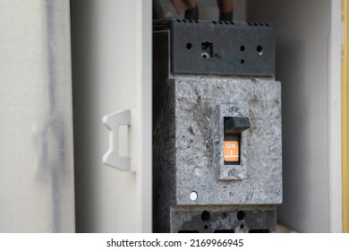 An electrical circuit breaker controller swtich on the junction box. Electrical equipment object photo, selective focus.