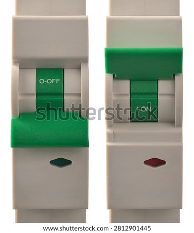 electrical circuit breakers isolated white background close-up, green switches in on and off positions in safety device