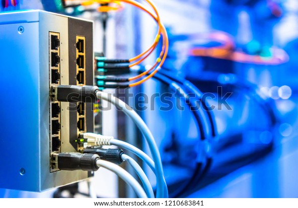 Electrical Circuits.  The\
electric wire behind the control board with lighting\
effect,Industrial Electrical Concept. Wiring PLC Control panel with\
wires industrial\
factory