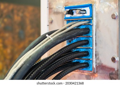 Electrical cords in fire panel. Flame stopping panel. wires are protected from fire. Black cables are inserted into connector. Fire-fighting electrical network. Concept - electrical wiring