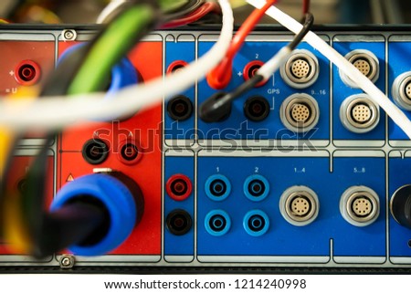 Electrical device for testing relay protections on power electric station. Maintenance tool. Equipments for test relion terminals. Test plugs and terminals closeup.