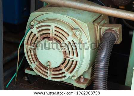 An electrical dynamo motor part in the power generator machine. Industrial equipment object, close-up photo.