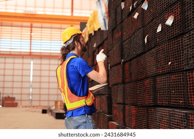 Electrical engineer railway checking construction process electric train and maintenance station .Engineer wearing safety uniform and helmet by using walki-talkie in work. transportation, transport.