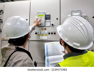 The Electrical Engineer Rechecks The Protection Relay Setting With A Witness.