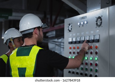 Electrical Engineer team working front HVAC control panels, Technician discussion and training daily check controls system for security functions in service room at factory. - Shutterstock ID 1627843918