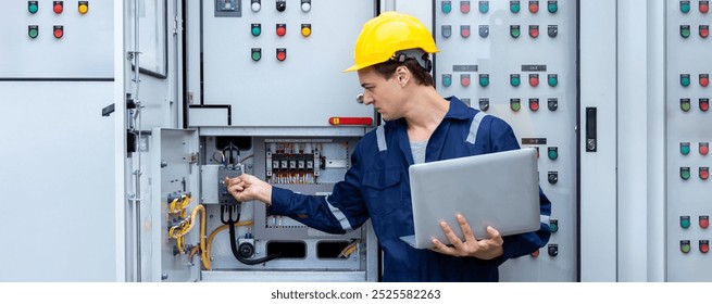 Electrical engineer working in control room. Electrical engineer man checking Power Distribution Cabinet in the control room
