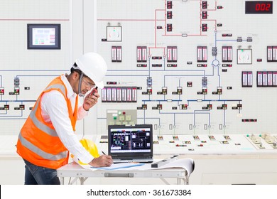 Electrical engineer working at control room of a modern thermal power plant