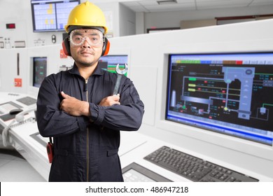 Electrical engineer working at control room of modern thermal power plant industrial