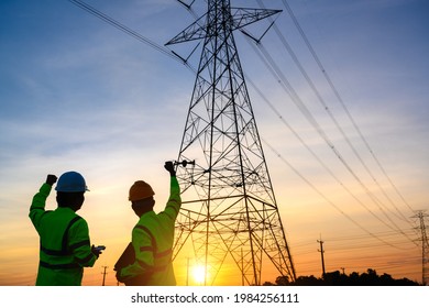 electrical engineer working at the power station See the planning of electricity production at high voltage poles. - Shutterstock ID 1984256111