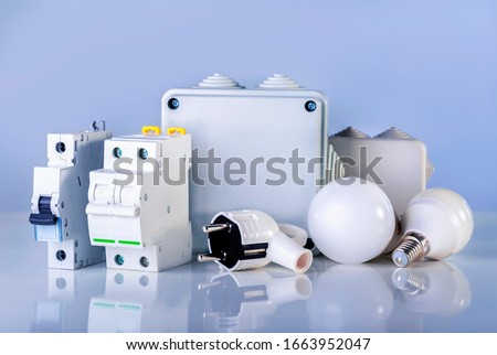 Electrical equipment on blue background. Various electric products on the store shelve.